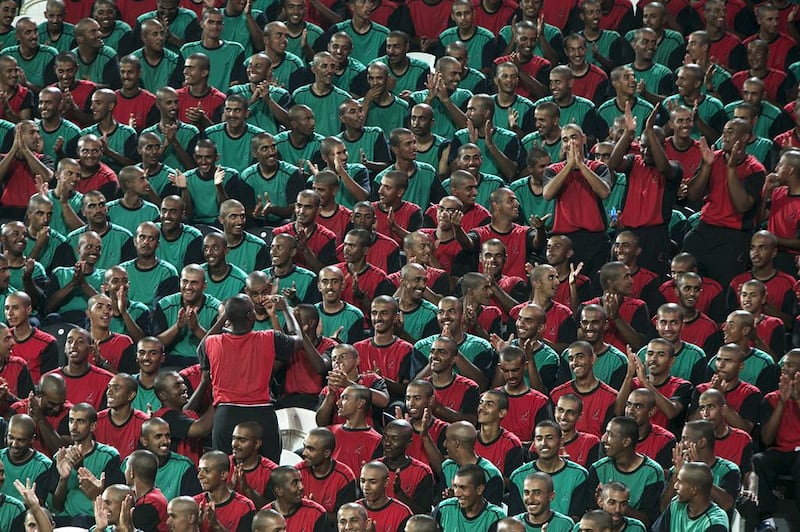 Al Ain police academy cadets cheer on the UAE. Silvia Razgova / The National