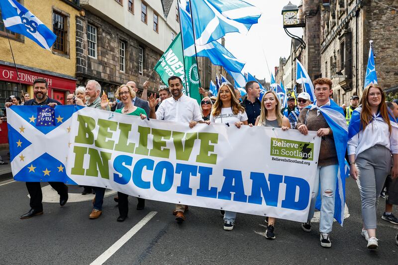 Mr Yousaf with hundreds of supporters of Scottish independence during a march in Edinburgh in September. Getty Images