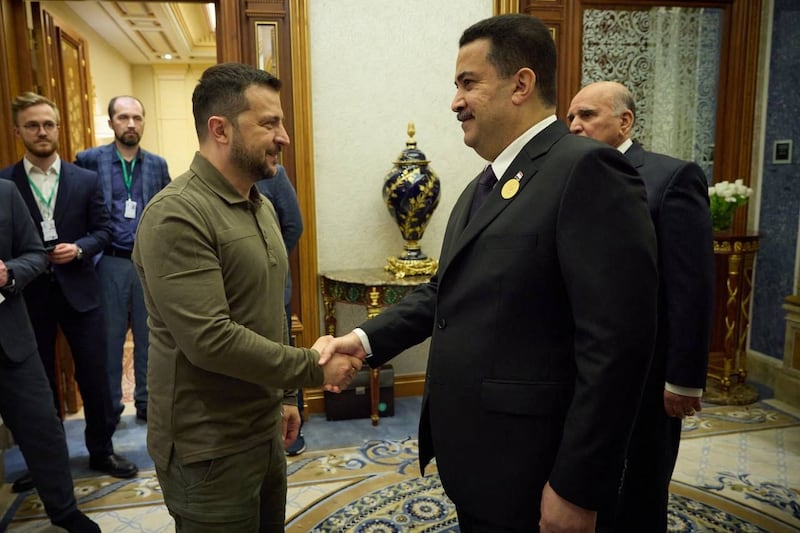 Iraqi Prime Minister Mohammed Shia Al Sudani, right, with Ukraine's President Volodymyr Zelenskyy at the Arab League Summit in Jeddah. AFP 