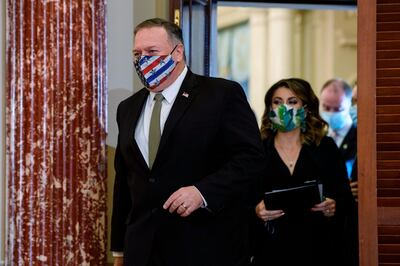 Secretary of State Mike Pompeo wears a mask as he arrives to hold a press conference with British Foreign Secretary Dominic Raab at the State Department in Washington, Wednesday, Sept. 16, 2020 in Washington. (Nicholas Kamm/Pool via AP)