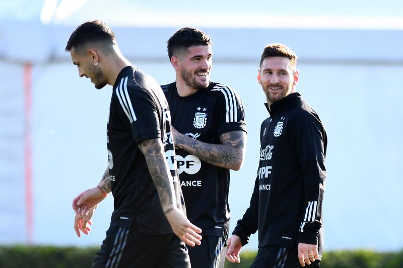 Leandro Paredes, Rodrigo De Paul and Lionel Messi during training. Getty