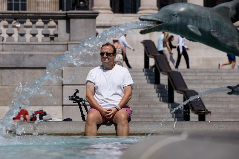 Many Londoners take to city fountains to cool off in the summer. Reuters