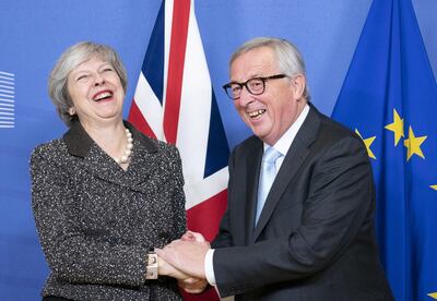 Bloomberg Best of the Year 2018: Theresa May, U.K. prime minister, and Jean-Claude Juncker, president of the European Commission, react during a handshake photocall ahead of talks in Brussels, Belgium, on Tuesday, Dec. 11, 2018. Photographer: Jasper Juinen/Bloomberg