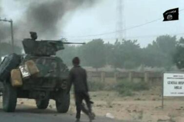 Boko Haram fighters during a Christmas Day attack on a military checkpoint in Nigeria's Molai village on the outskirts of the northeast Nigerian city of Maiduguri, which the military said was thwarted by troops after one hour of battle. AFP