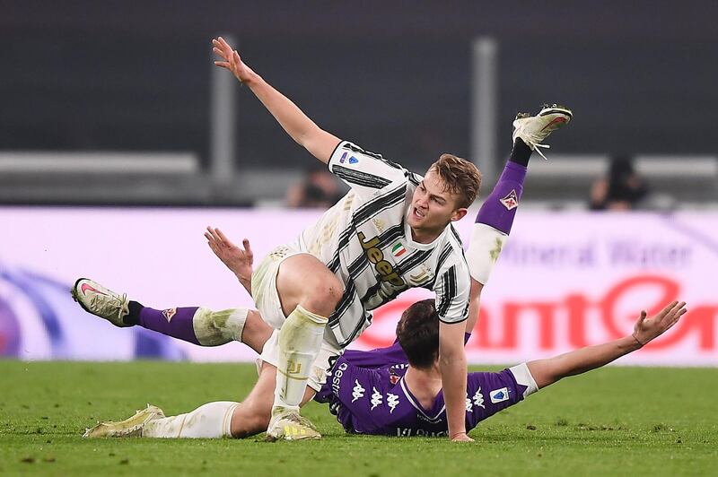 Matthijs de Ligt, top, and Dusan Vlahovic tussle during the match. AP