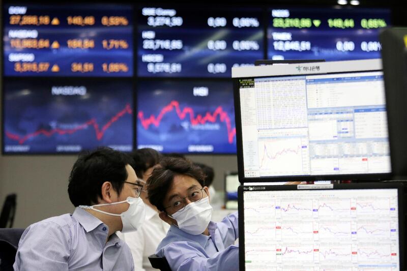Currency traders work at the foreign exchange dealing room of the KEB Hana Bank headquarters in Seoul, South Korea. AP Photo