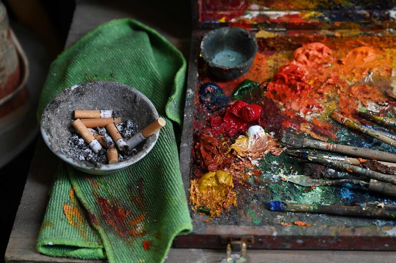 A view of the oil paints Deng Fei uses as he takes a break from painting Van Gogh replicas