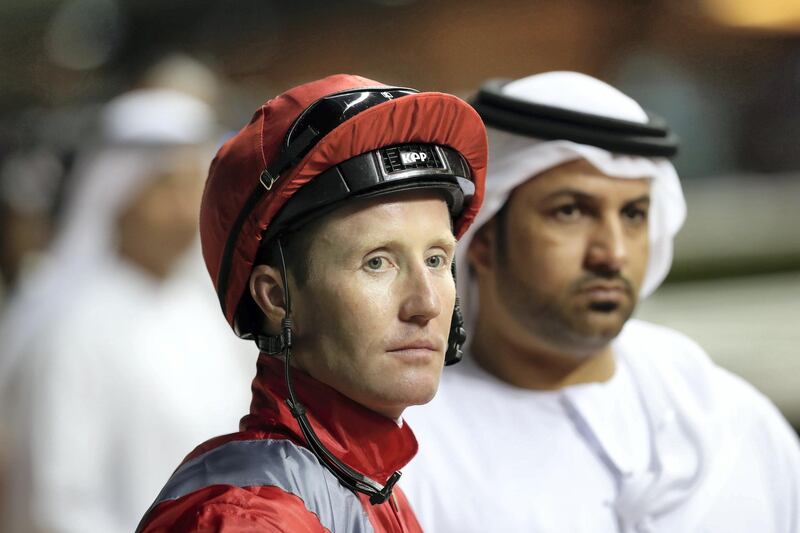 Dubai, United Arab Emirates - October 24, 2019: Patrick Cosgrave waits to mount Puzzle Elegance before the Emirates Holidays race on the opening meeting of the new season. Thursday the 24th of October 2019. Meydan Racecourse, Dubai. Chris Whiteoak / The National