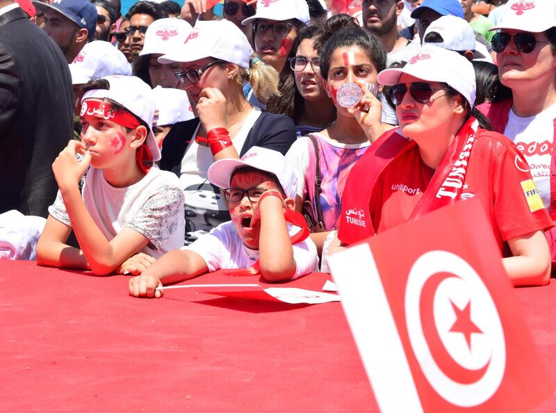 epa06834103 Tunisian fans react as they watch the FIFA World Cup 2018 group G preliminary round match between Belgium and Tunisia, by La Marsa beach, Tunis, Tunisia, 23 June 2018. Tunisia lost by 4-1 to Belgium and got knocked out of the World Cup.  EPA/STR