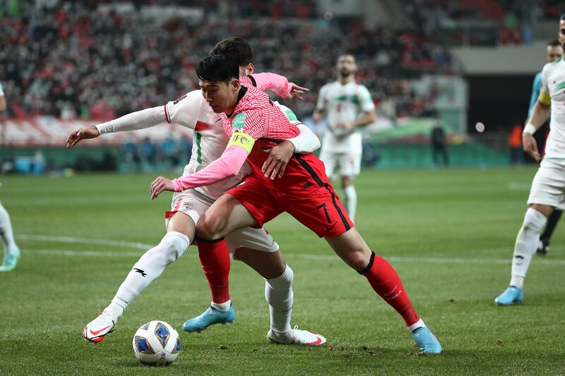 South Korea's Son Heung-Min under pressure from Shojae Khalilzadeh of Iran. Getty