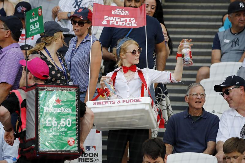 A vendor sells sweets during the first of a two-game series between the New York Yankees and the Boston Red Sox at London Stadium in Queen Elizabeth Olympic Park, east London.  As Major League Baseball prepares to make history in London, New York Yankees manager Aaron Boone and Boston Red Sox coach Alex Cora are united in their desire to make the ground-breaking trip memorable on and off the field. AFP