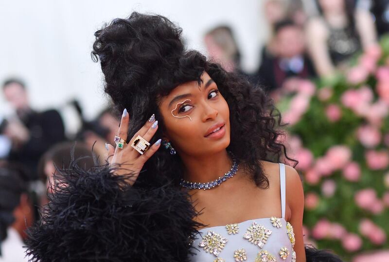 Actress Yara Shahidi kept her look pared-back, save for the squiggle of crystals swept across one eyelid. AFP