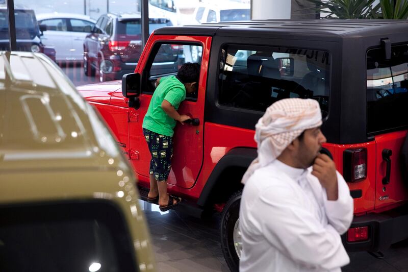 Abu Dhabi, United Arab Emirates, May 27, 2013: 
A potential customer checks out the latest models of Jeep SUVs as he shops around for a car on Monday, May 27, 2013, at the Emirates Motor Company showroom on Airport Road in Abu Dhabi.
Silvia Razgova / The National

