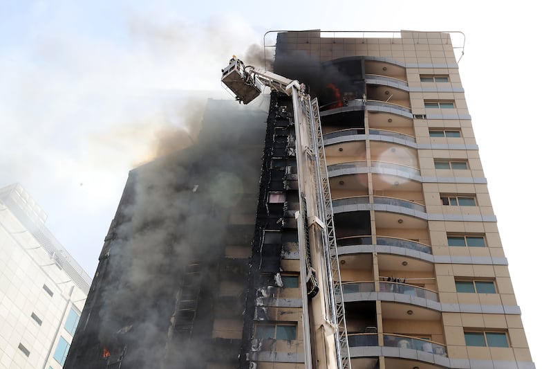 Fire broke out at a residential building in the Al Barsha area of Dubai on Friday. All photos: Pawan Singh / The National