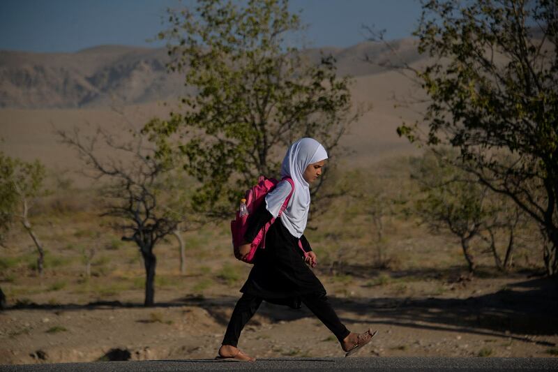 A child on her way to school on the outskirts of Herat. Girls have returned to some secondary schools in a northern province of Afghanistan, Taliban officials and teachers said. AFP