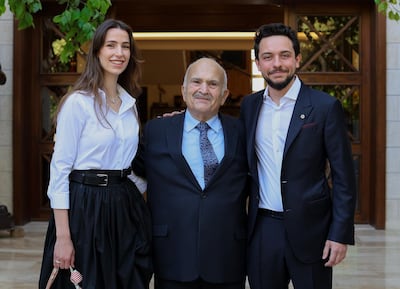 Princess Rajwa wore a white shirt and black skirt, both by Alexander McQueen, to visit the Royal Hashemite Court in October 2022. Crown Prince Hussein / Instagram