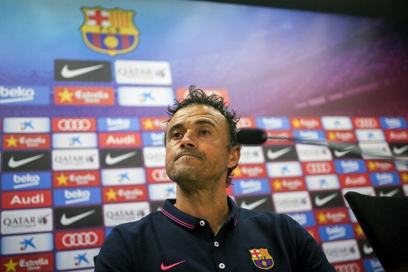 Luis Enrique shown at a Barcelona press conference on Saturday. His team have four wins from four La Liga matches this season. Alejandro Garcia / EPA / September 20, 2014