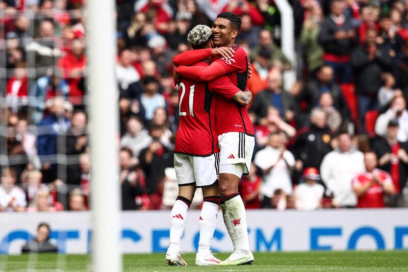 Manchester United's Antony celebrates with Casemiro after scoring the second goal. AFP