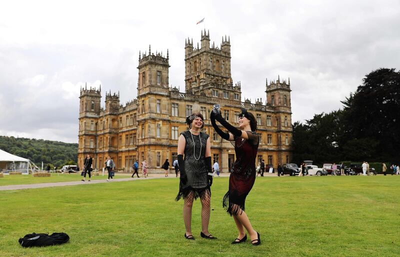 Visitors attend a 1920s themed event at Highclere Castle, near Newbury, west of London, on September 7, 2019, ahead of the world premiere of the Downton Abbey film. AFP