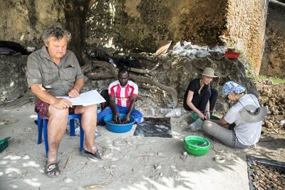 Dr Mark Horton, a professor of archaeology at the University of Bristol in the UK, and members of the team processing finds inside Stone Town's fort in Zanzibar. An expert in the maritime archaeology and the Indian Ocean trade, Dr Horton has been conducting excavations in East Africa since 1984.