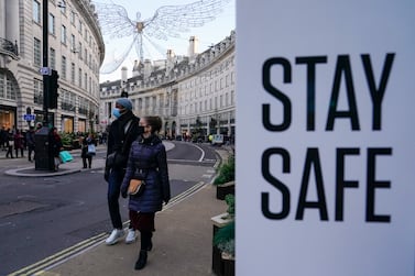 FILE - People wear face masks as they walk, in Regent Street, in London, Sunday, Nov.  28, 2021.  The number of new coronavirus cases across Britain has surged by more than 30% in the last week, with cases largely driven by the super infectious omicron variants.  Data released by Britain’s Office for National Statistics on Friday, July 1, 2022 showed that more than 3 million people in the U. K.  had COVID-19 last week, although there has not been an equivalent spike in hospitalizations.  (AP Photo / Alberto Pezzali, File)