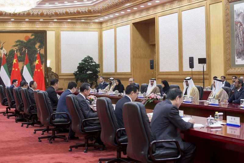 Sheikh Mohammed bin Zayed, Crown Prince of Abu Dhabi and Deputy Supreme Commander of the Armed Forces, meets with Xi Jinping, President of China (4th L), at the Great Hall of the People during a state visit to China. Seen with Hussain Al Hammadi, Minister of Education, Lt Gen Sheikh Saif bin Zayed, Deputy Prime Minister and Minister of Interior, Dr Amal Al Qubaisi, Speaker of the Federal National Council, Sheikh Hamed bin Zayed, Chairman of Crown Prince Court - Abu Dhabi and Managing Director of the Abu Dhabi Investment Authority (ADIA), Dr Anwar Gargash, Minister of State for Foreign Affairs, Reem Al Hashimi, Minister of State, Mohammed Al Bowardi, Undersecretary of the Ministry of Defence and Khaldoon Al Mubarak, Chief Executive and Managing Director Mubadala and Chairman of the Abu Dhabi Executive Affairs Authority (EAA). Mohamed Al Hammadi / Crown Prince Court - Abu Dhabi