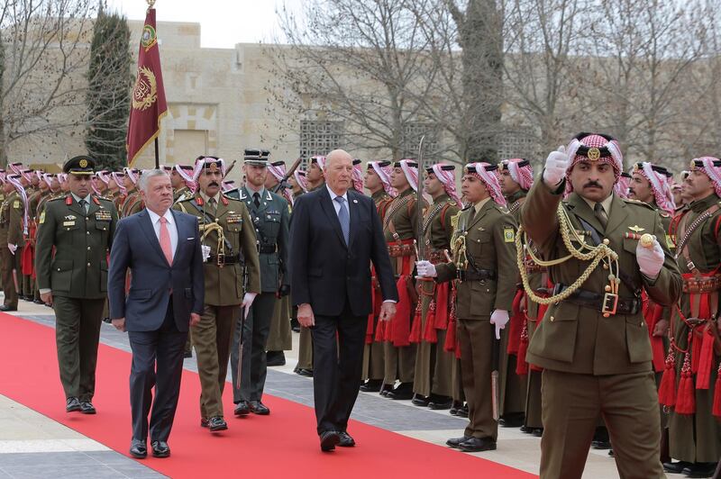 Norway's King Harold, reviews an honour guard at the Husayniyah Palace, in Amman, Jordan. AP Photo