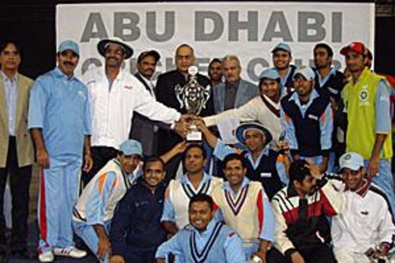 The Arab Udupi players celebrate after beating Seven Seas, in the ADCC Division One tournament final at the Zayed Cricket Stadium.