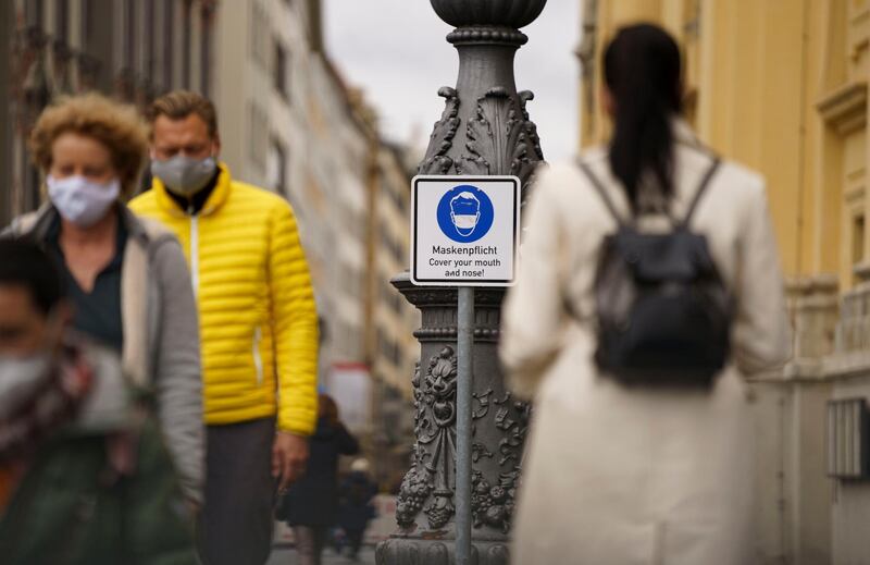 A sign indicates that masks are compulsory in the city centre in Munich, Germany. EPA