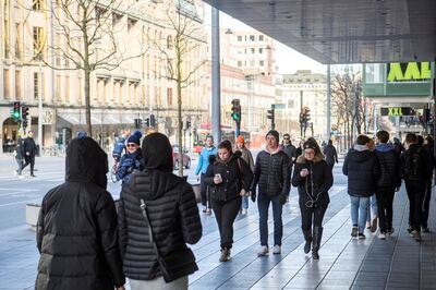 People walk in Stockholm as the spread of the coronavirus disease (COVID-19) continues, Sweden April 4, 2020. Henrik Montgomery/TT News Agency/via REUTERS ATTENTION EDITORS - THIS IMAGE WAS PROVIDED BY A THIRD PARTY. SWEDEN OUT. NO COMMERCIAL OR EDITORIAL SALES IN SWEDEN.