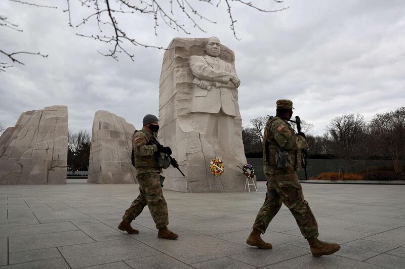 WASHINGTON, DC - JANUARY 17: Members of the Florida National Guard walk near the Martin Luther King Jr. Memorial on January 17, 2021 in Washington, DC. After last week's riots at the U.S. Capitol Building, the FBI has warned of additional threats in the nation's capital and in all 50 states. According to reports, as many as 25,000 National Guard soldiers will be guarding the city as preparations are made for the inauguration of Joe Biden as the 46th U.S. President.   Joe Raedle/Getty Images/AFP
== FOR NEWSPAPERS, INTERNET, TELCOS & TELEVISION USE ONLY ==
