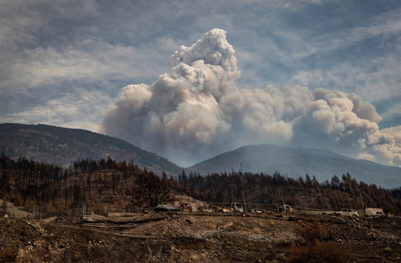 A pyrocumulus cloud, also known as a fire cloud, rises in the mountains above Lytton, British Columbia, Canada.