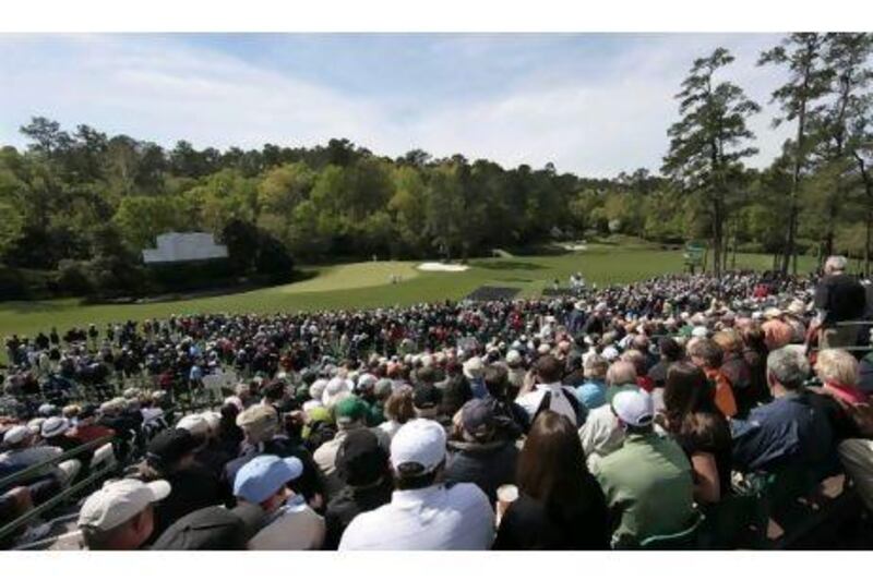 Crowds have gatherd in droves to watch the world's top golfers practise at Augusta National this week. Charlie Riedel / AP Photo