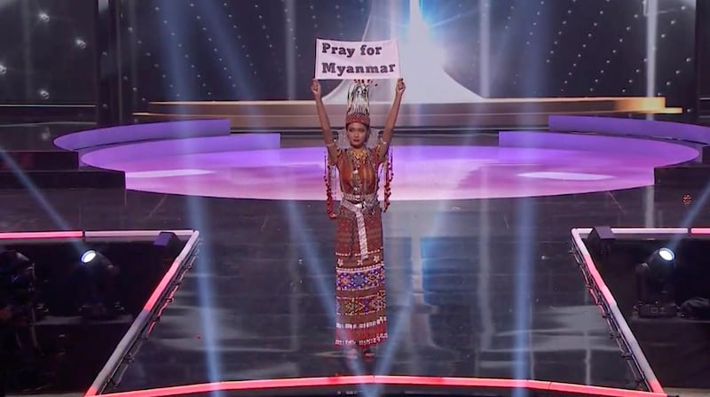 Miss Myanmar Thuzar Wint Lwin holds up a 'Pray for Myanmar' sign during Miss Universe pageant's national costume show, in Hollywood, Florida, US. Lwin won the Best National Costume. Reuters