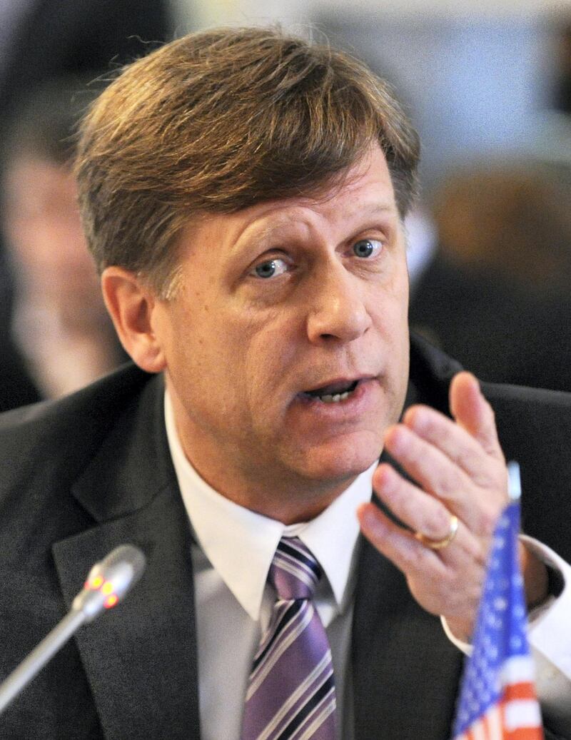 US ambassador to Russia, Michael McFaul, speaks as he takes  part in a round table discussion on NGO cooperation between the two countries  in Moscow, on April 4, 2013. AFP PHOTO / YURI KADOBNOV / AFP PHOTO / YURI KADOBNOV