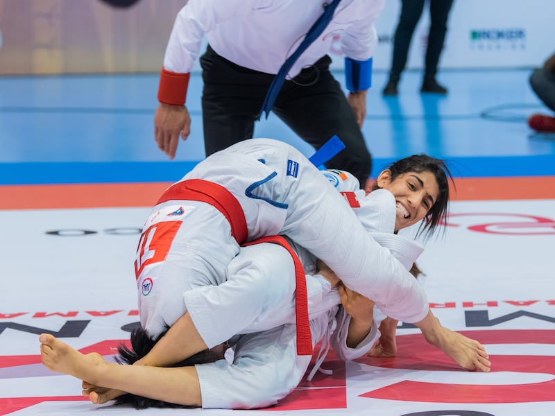 Emirati Shamma Al Kalbani, right, won the women’s 63kg final by submission in the sixth Asian Jiu-Jitsu Championship at the National Stadium in Manama, Bahrain. Photo: UAEJJF