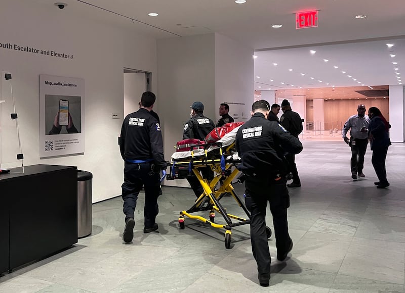 Medical teams arrive after the stabbing incident. AP