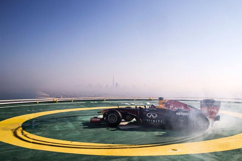 David Coulthard of Scotland performs in a Red Bull Racing Formula One car on the helipad of the Burj Al Arab hotel in Dubai. Samo Vidic/Red Bull Content Pool