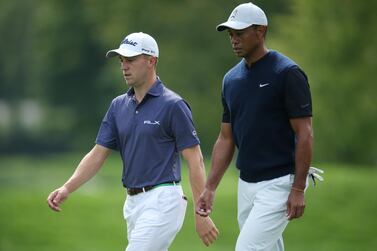 Justin Thomas, left, and Tiger Woods walk down the 12th fairway during the first round of the US Open at Winged Foot Golf Club. Reuters