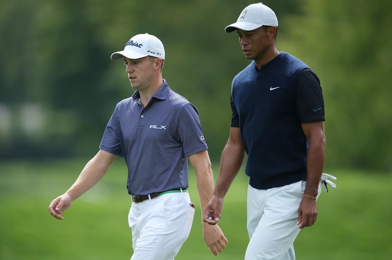 Sep 17, 2020; Mamaroneck, New York, USA; Justin Thomas (L) and Tiger Woods (R) walk down the 12th fairway during the first round of the U.S. Open golf tournament at Winged Foot Golf Club - West. Mandatory Credit: Brad Penner-USA TODAY Sports