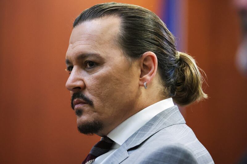 Depp stares at the jurors. Reuters