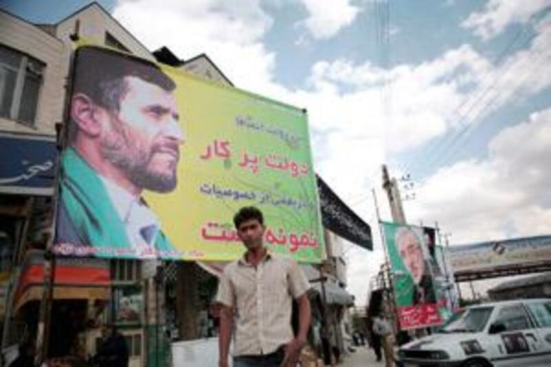 Election posters in Damavand for Mahmoud Ahmadinejad, left, and his main rival, Mir Hossein Mousavi.