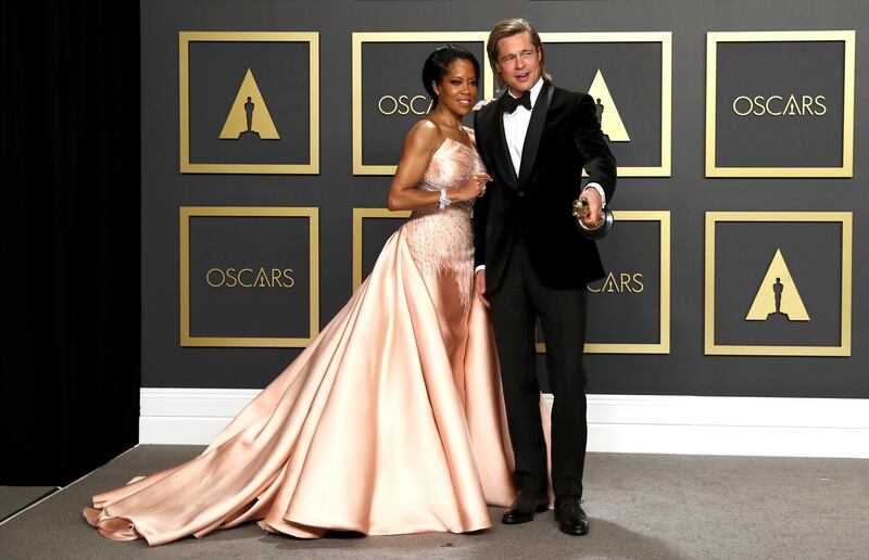 Brad Pitt poses in the press room with Regina King with the Oscar for Best Supporting Actor at the 92nd Academy Awards on Sunday, February 9. EPA