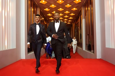 CORRECTION / Sudanese director Amjad Abu Alaa (R) and actor Hassan Ali walk on the red carpet as they attend the premiere of the movie "You Will Die at Twenty" during the 3rd edition of the Elgouna Film Festival at the Egyptian Red Sea resort of Elgouna on September 20, 2019.  RESTRICTED TO EDITORIAL USE

 / AFP / ELGOUNA FILM FESTIVAL / Patrick BAZ / RESTRICTED TO EDITORIAL USE

