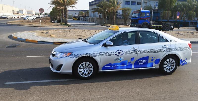 A hybrid taxi on the road in Abu Dhabi. Ravindranath K / The National