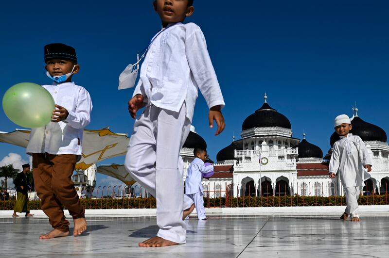 Children in the grounds of Baiturrahman Grand Mosque before the start of Ramadan in Banda Aceh, Indonesia, in March. AFP