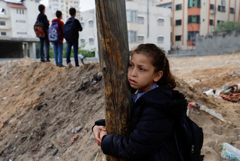 Children survey the damage. Reuters