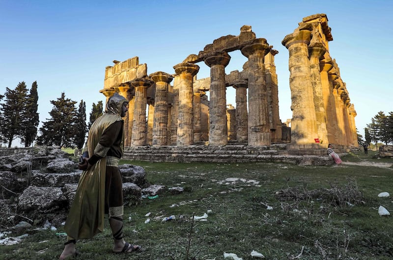 A actor in costume approaches the Unesco-listed Temple of Zeus in the ruins of Libya's ancient eastern city of Cyrene during the filming of a television production. AFP