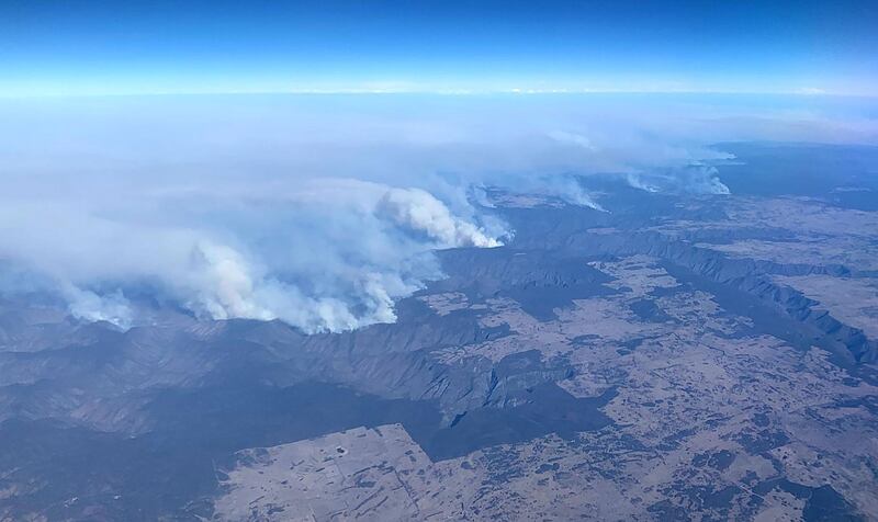 A picture taken from a plane over north eastern New South Wales shows bushfires.  AFP