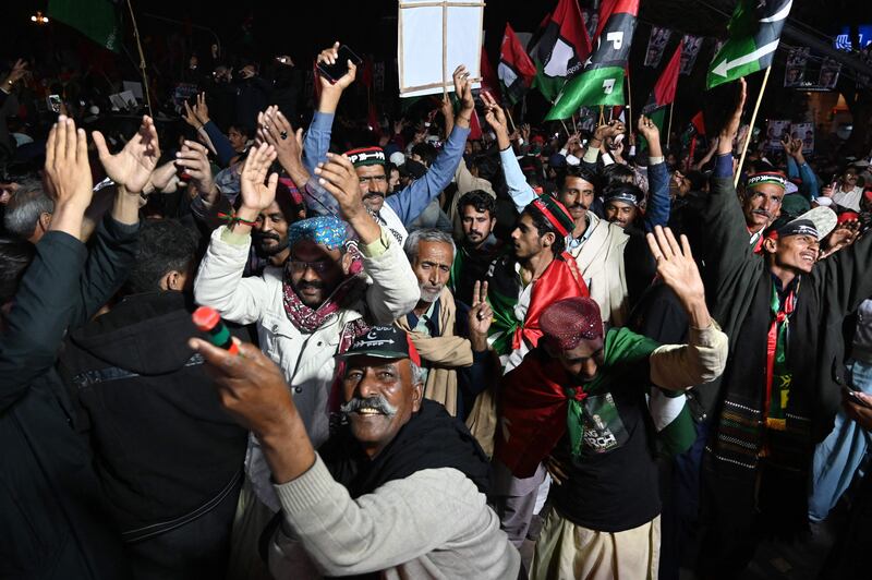 PPP supporters at the rally. The formal request requires Mr Khan to seek a parliamentary vote of confidence. AFP